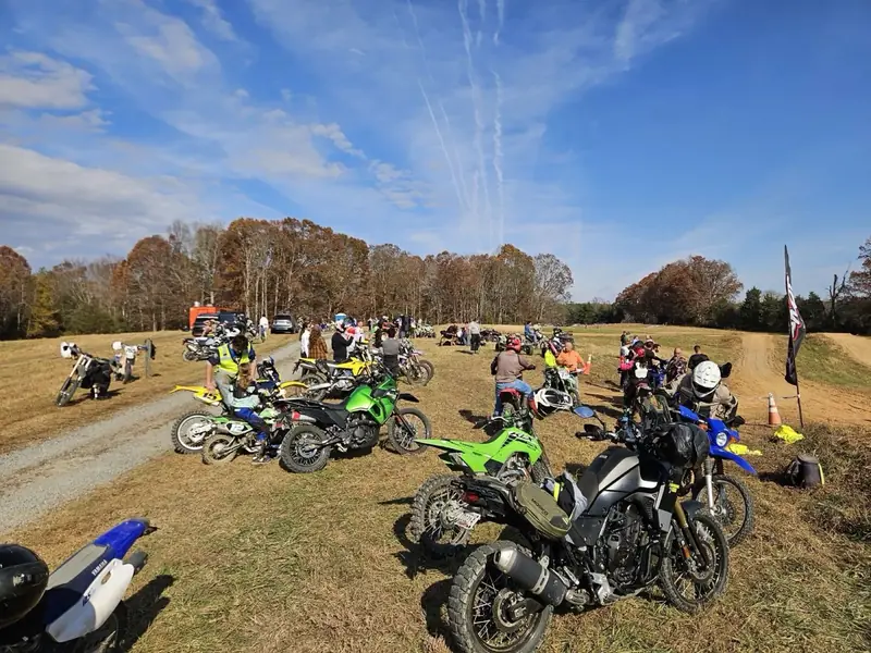 Rows of dirt bikes lined up at a Throttle Therapy Day Ride event